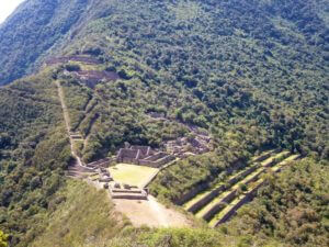 some incan ruins in the middle of lots of trees, the terraces and buildings have been cleared of trees