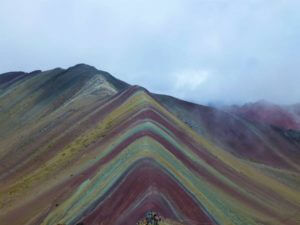 a mountain with lots of different colours in an inverted v shape